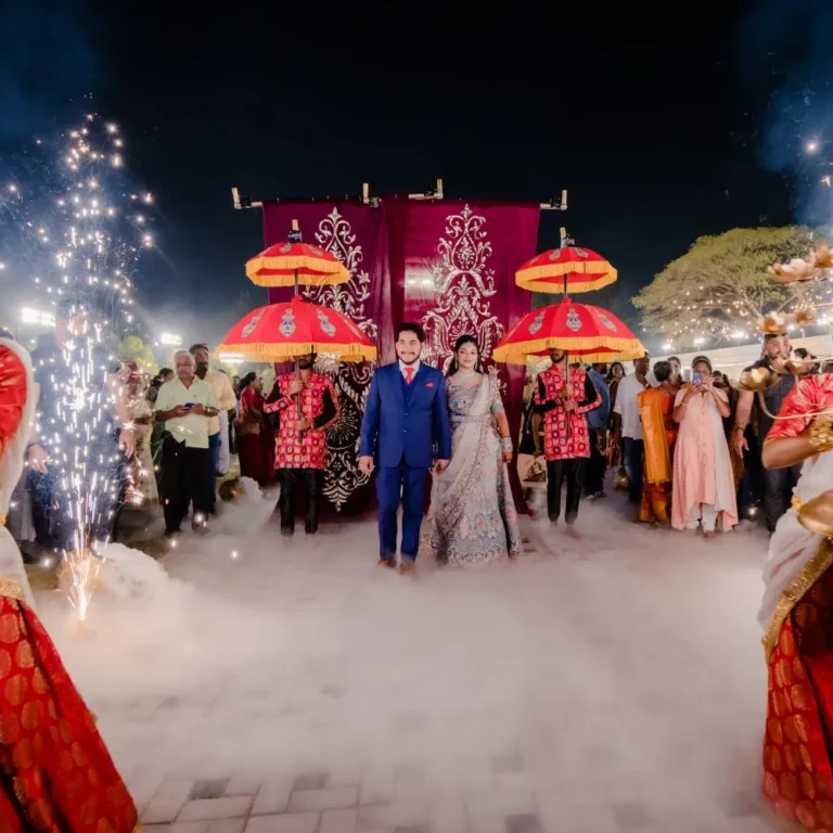 The bride and groom hold hands as they make a grand entrance at their reception