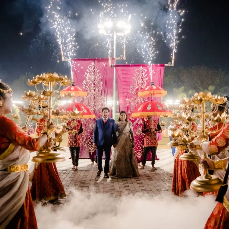 Bride and groom holding hands as they make a grand entrance at their reception, both smiling beautifully